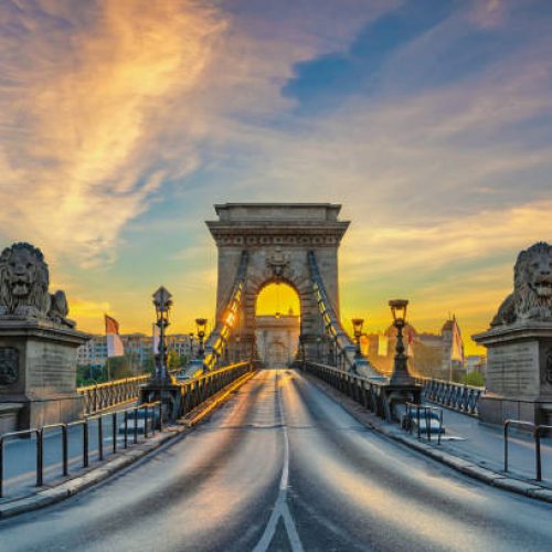 Budapest Hungary, city skyline sunrise at Chain Bridge with famous lion statue